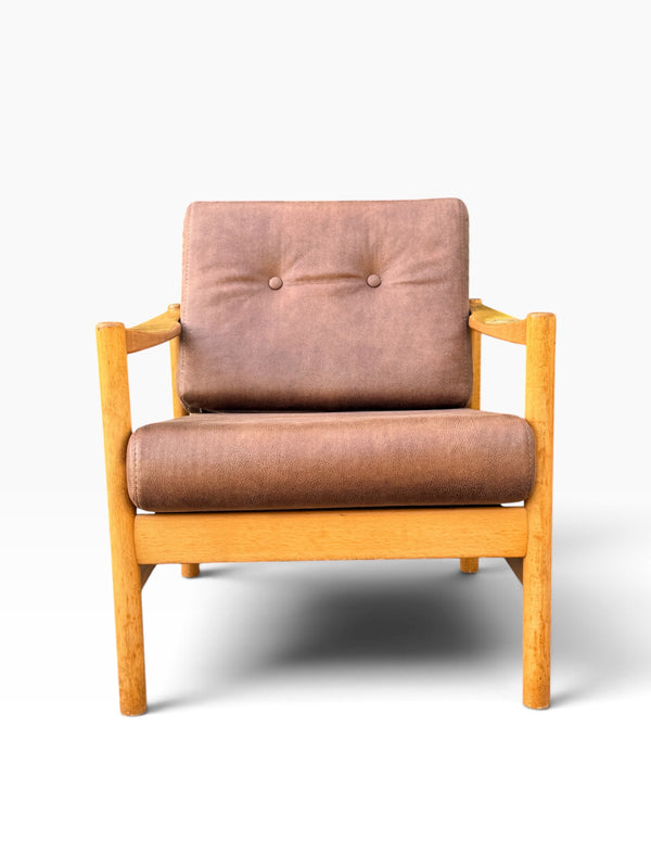 Mid-century Danish modern lounge chair with brown leather cushions, front view