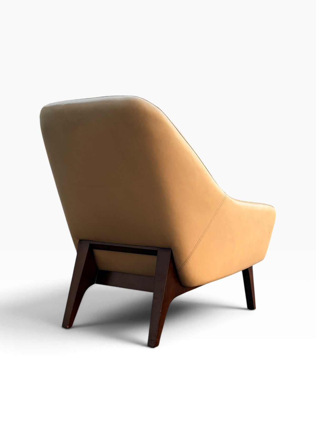 Rear three-quarter view showing walnut support bracket