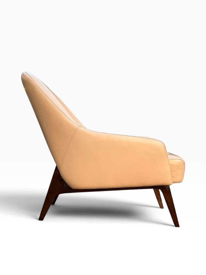 Side profile of cream leather lounge chair