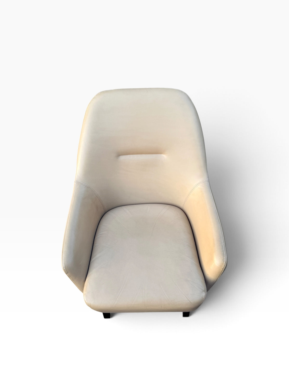 Cream leather lounge chair seat from above