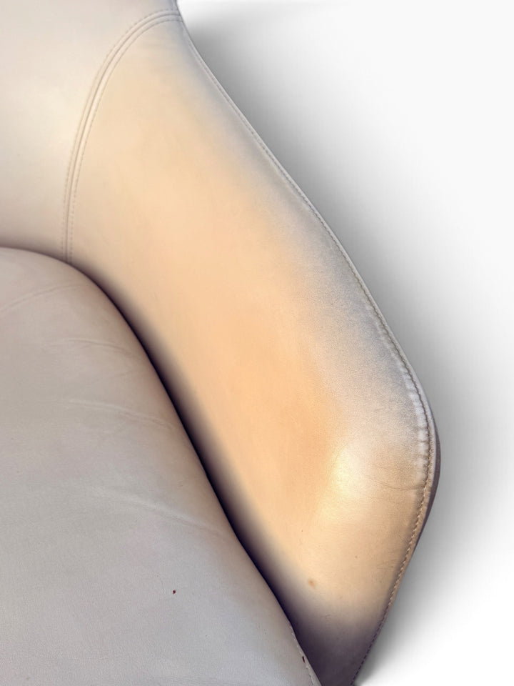 Close-up of cream leather arm and topstitching