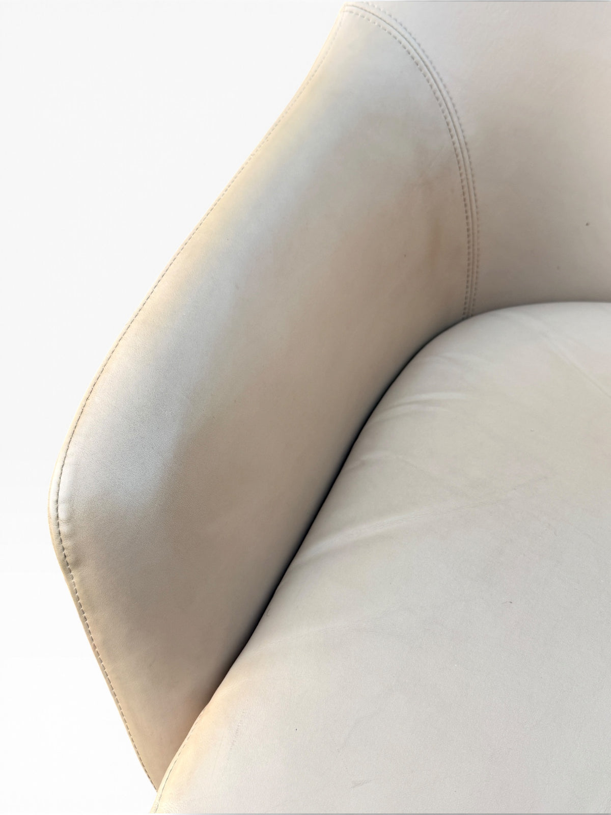 Detail of leather arm and seat edge