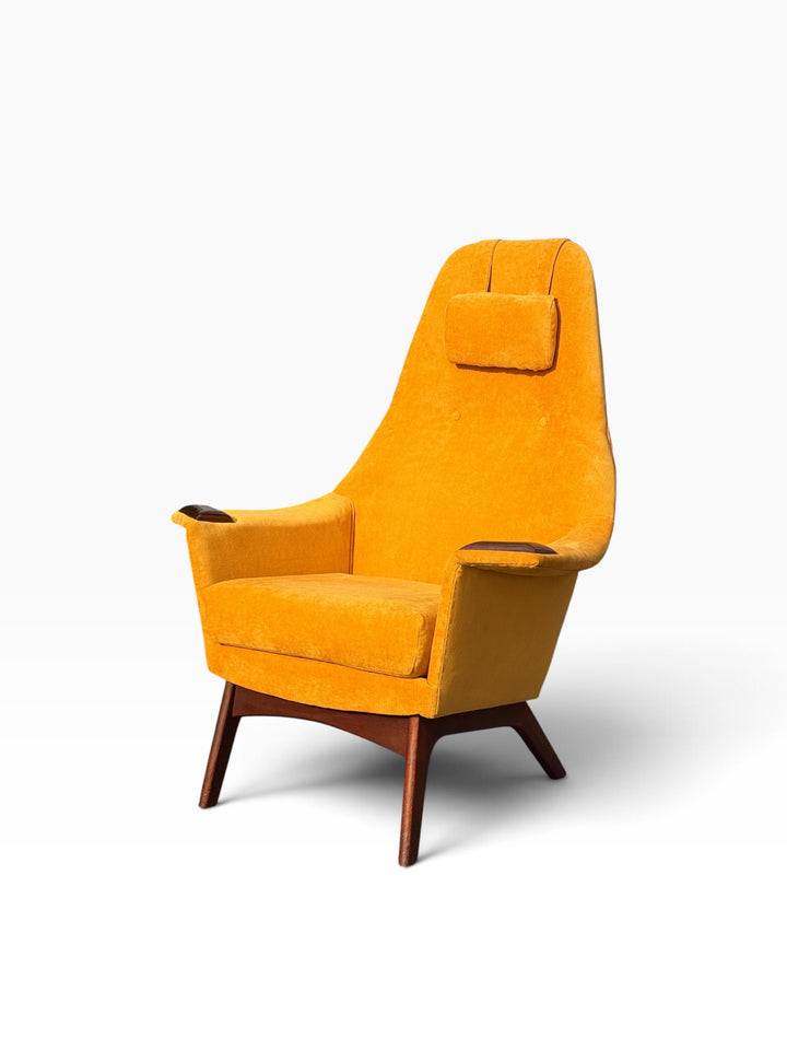 Mid-century high-back lounge chair on sculpted walnut base, three-quarter view