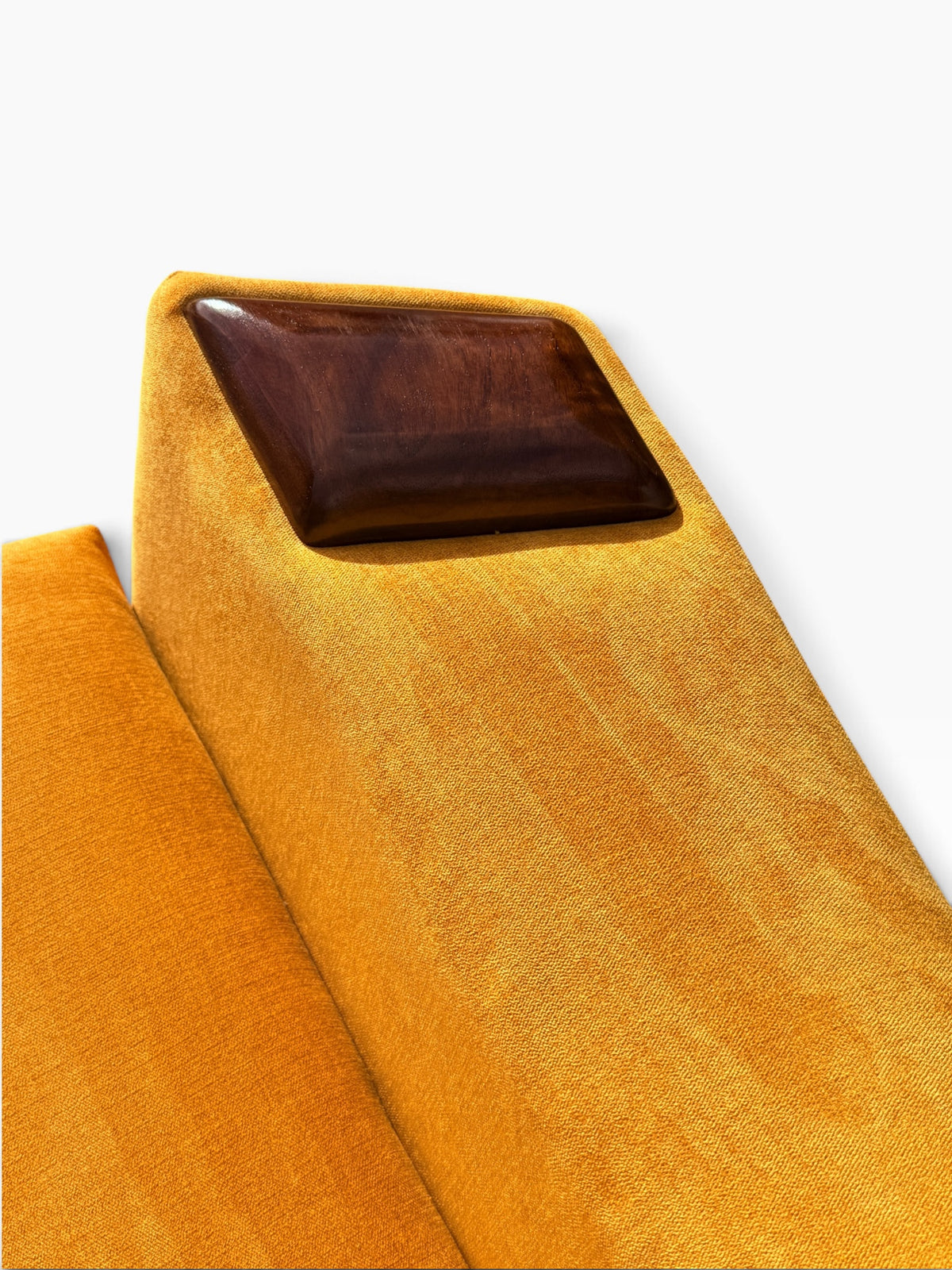 Walnut arm cap and upholstered arm detail