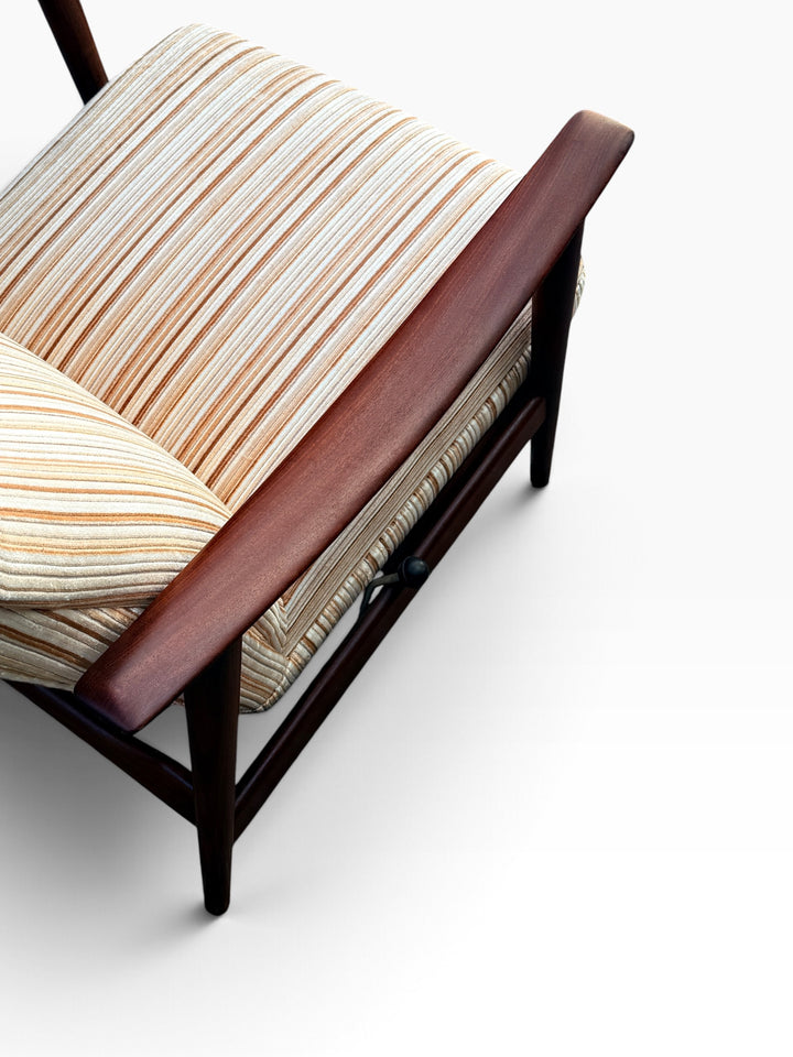 Opposite walnut armrest and seat, high angle detail