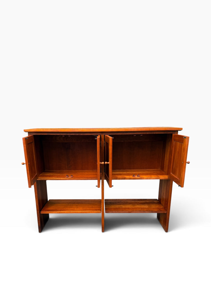 All four doors open on cherry sideboard console