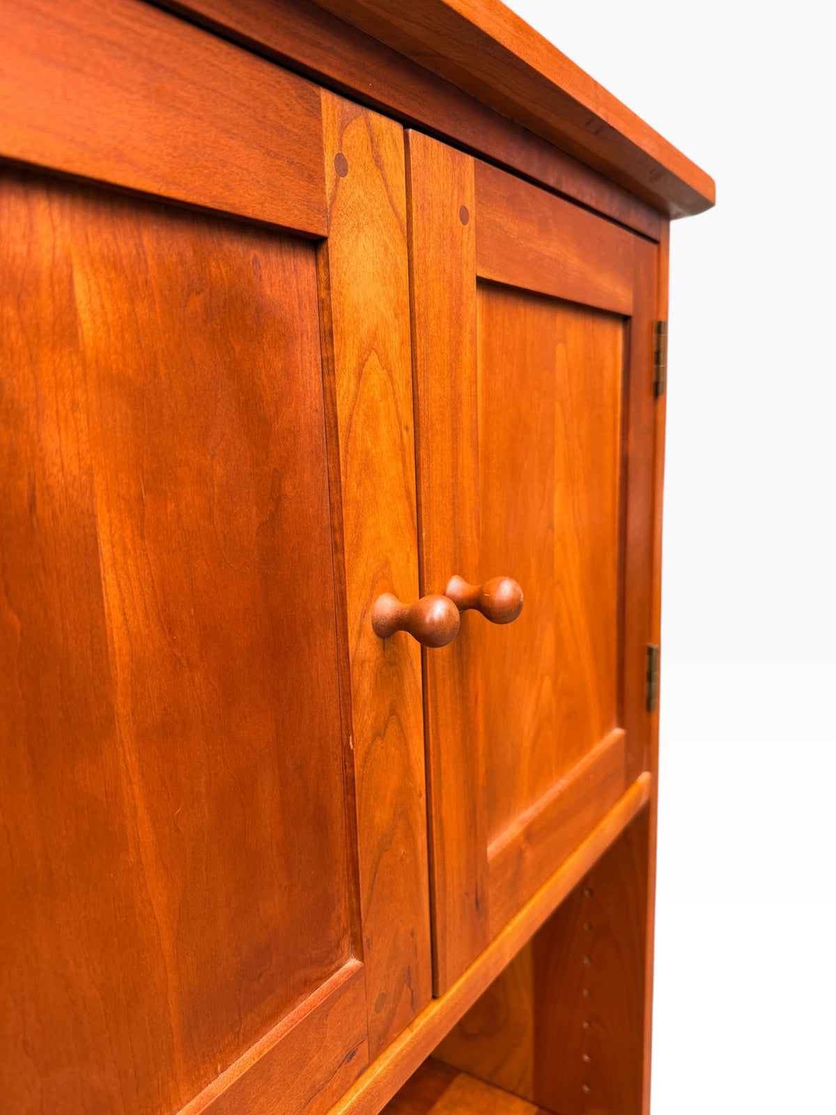 Exposed pegged joinery detail on cherry sideboard