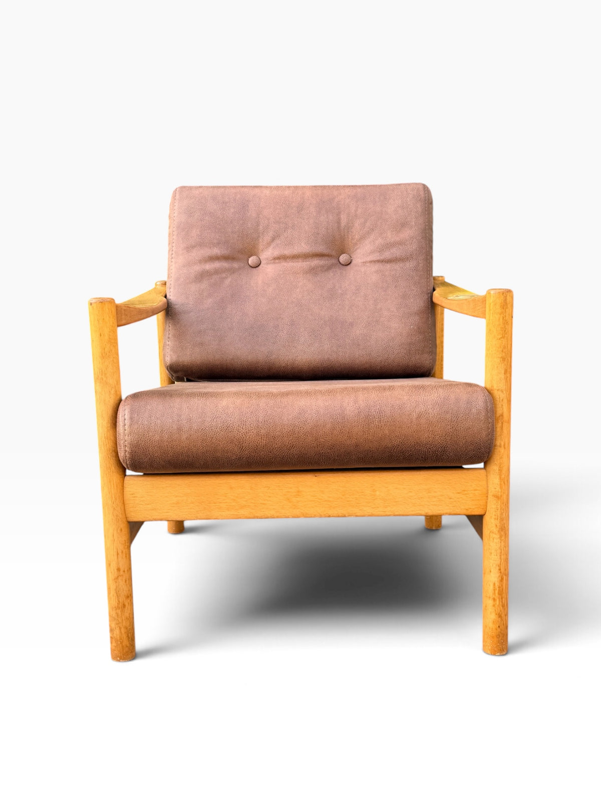 Mid-century Danish modern lounge chair with brown leather cushions, front view
