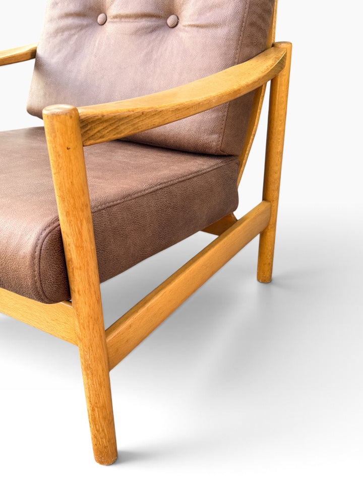 Detail of armrest joint and leather seat cushion