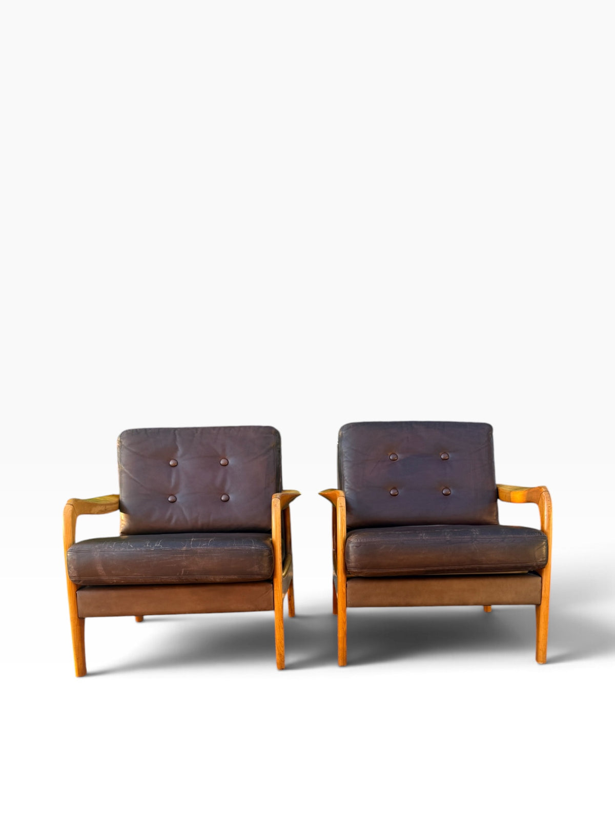 Pair of Danish leather lounge chairs, front view
