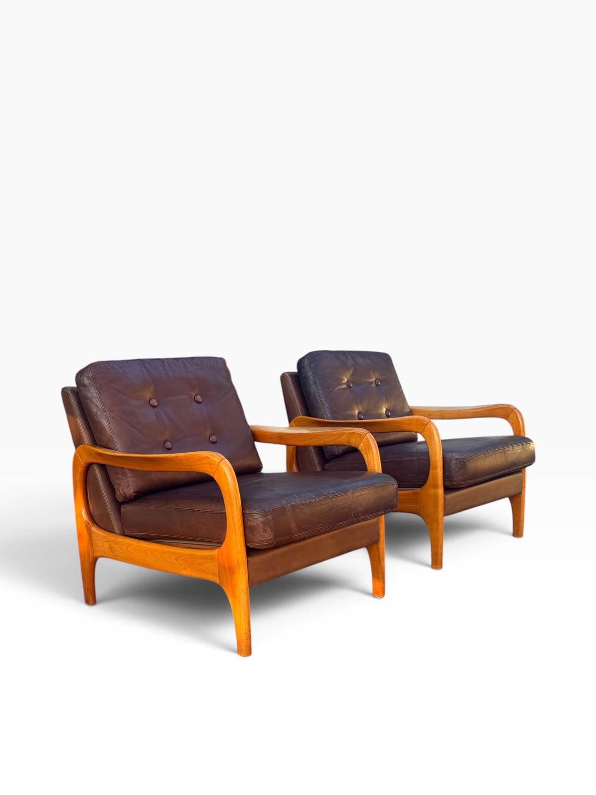 Pair of Danish modern lounge chairs with sculpted maple arms