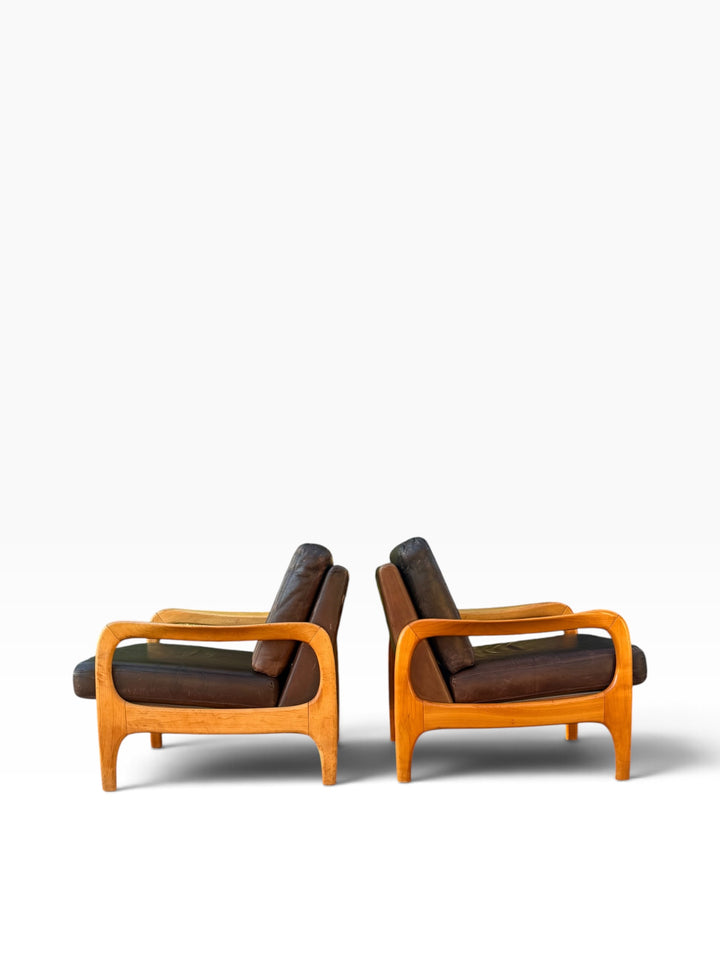 Pair of Danish lounge chairs in side profile