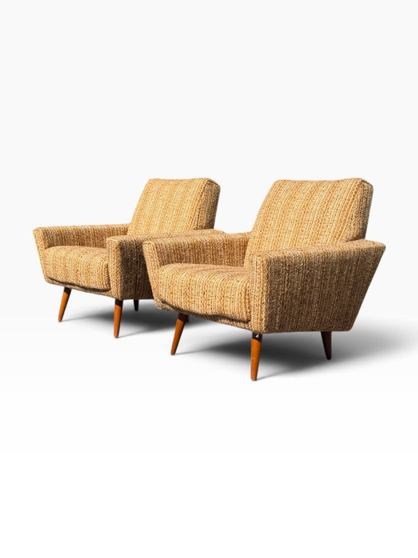Pair of Danish modern lounge chairs in woven oatmeal tweed, three-quarter view