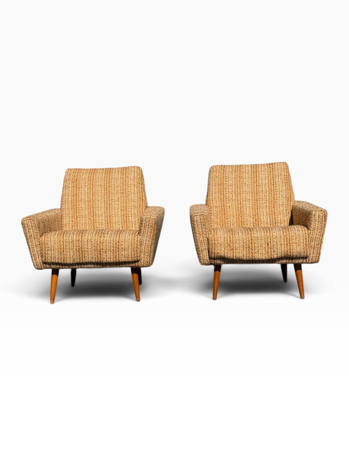 Pair of Danish modern lounge chairs with flared arms, front view