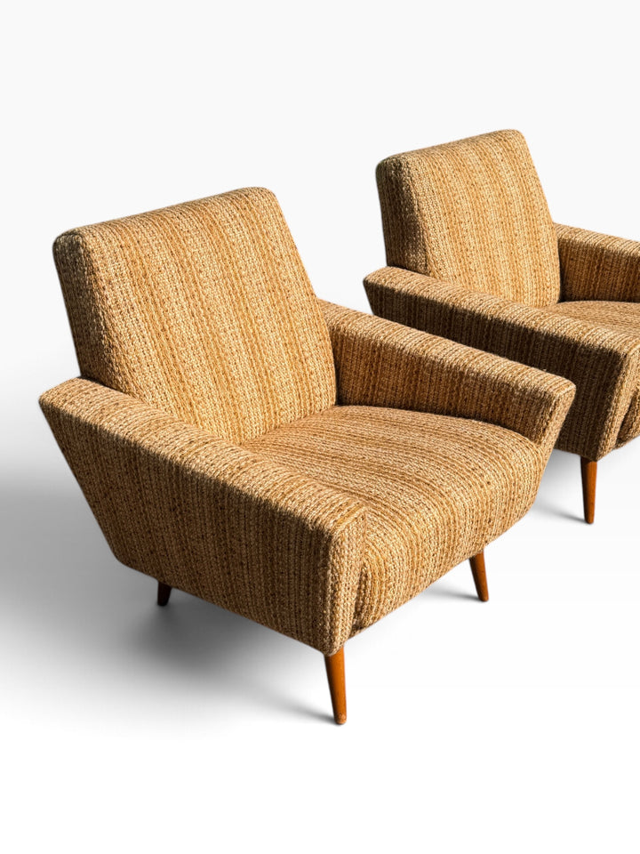 Pair of mid-century lounge chairs, three-quarter view from the opposite side
