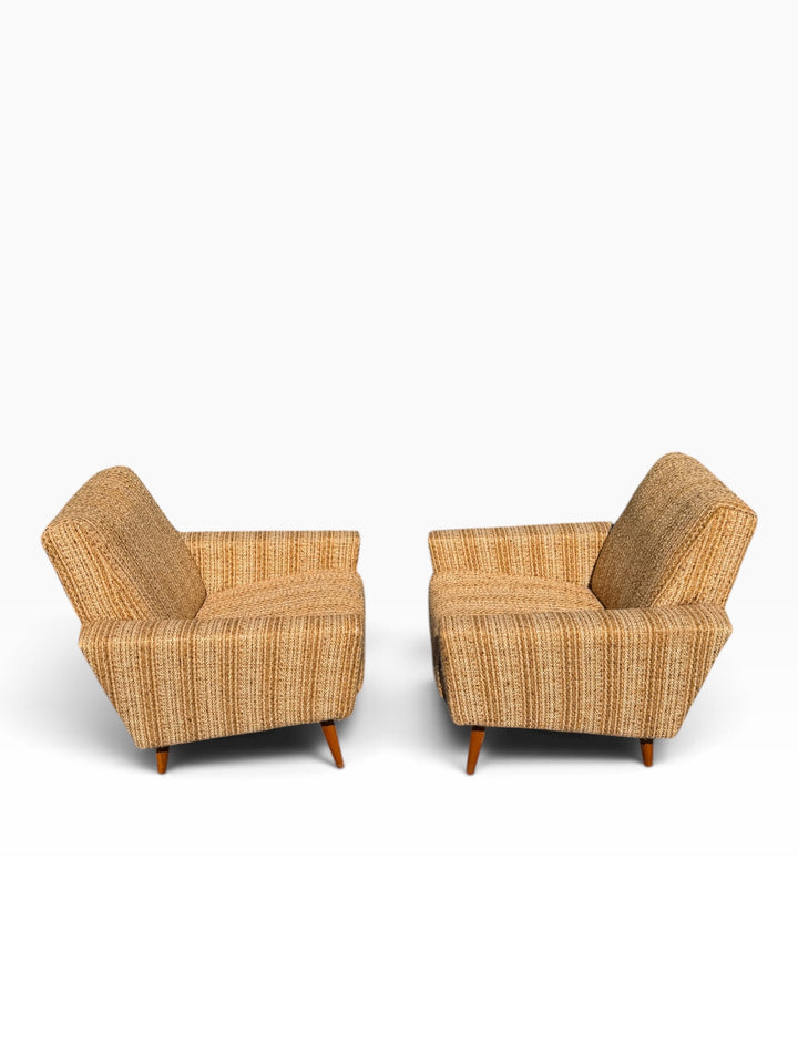 Pair of mid-century lounge chairs, rear three-quarter view