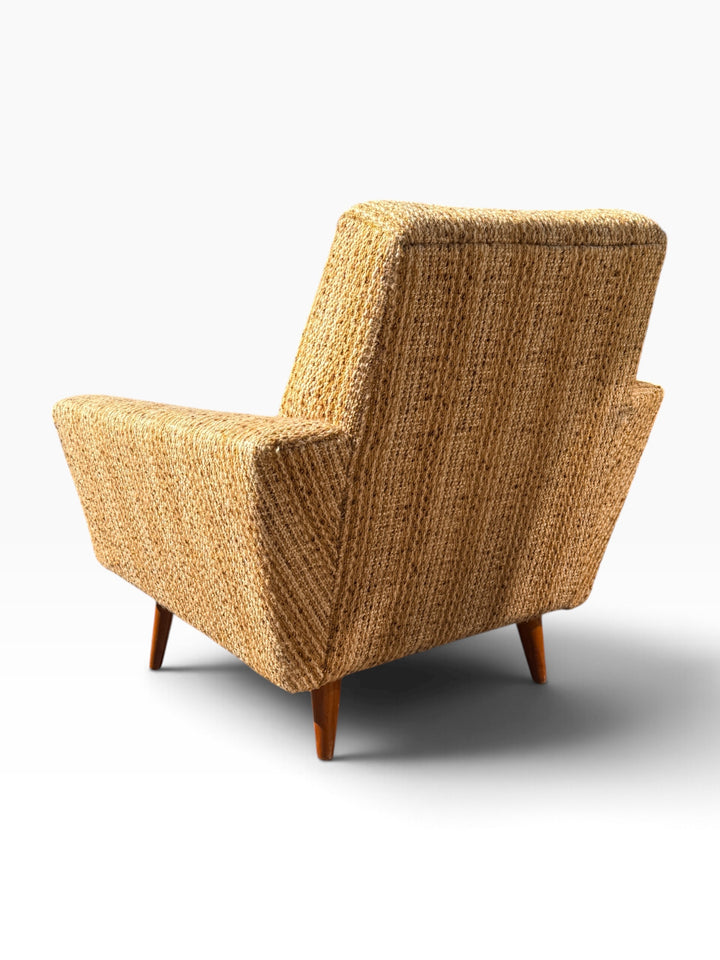 Single lounge chair, rear three-quarter view with tapered wood legs