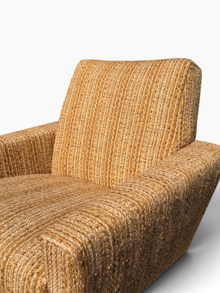 Close-up of arm upholstery showing texture and wear