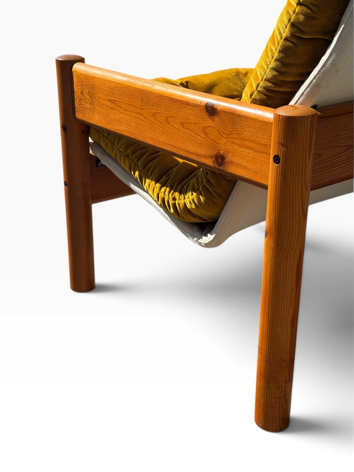 Detail of the solid pine arm rail, knots and bolt joinery