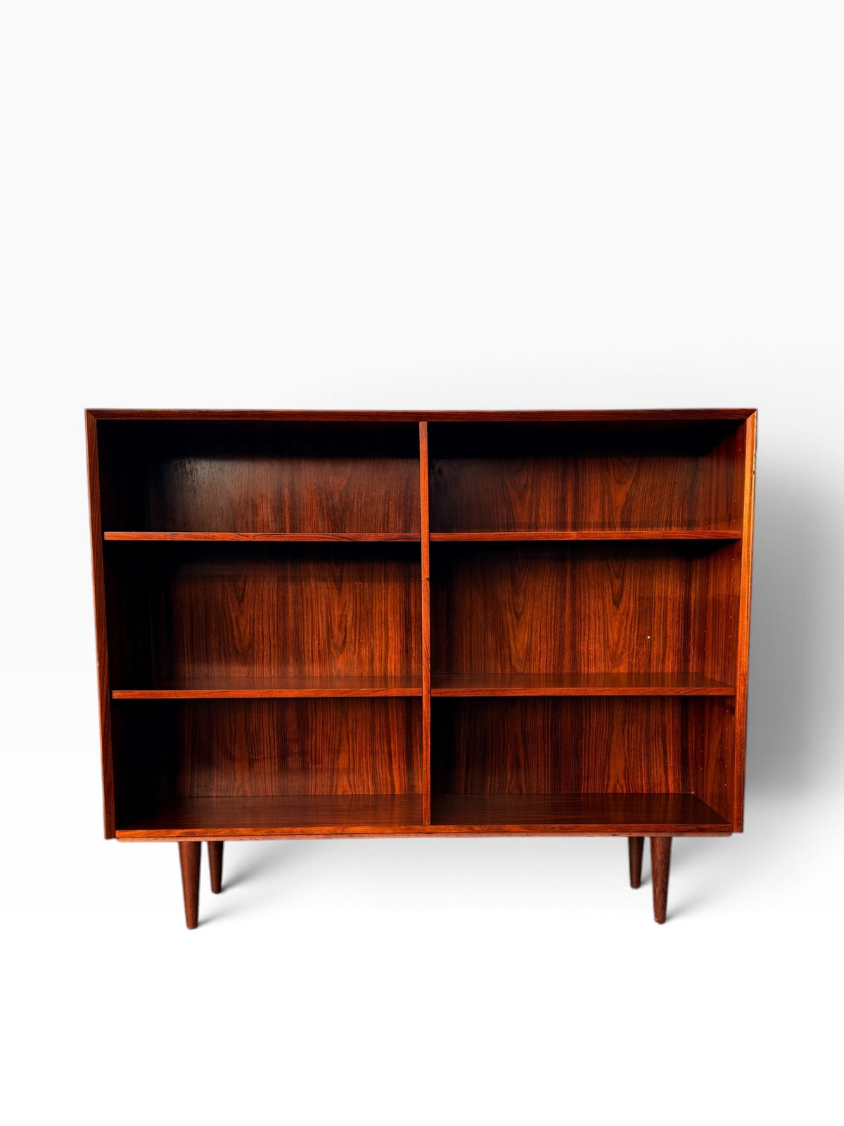 Mid-century Danish rosewood bookcase, front view showing two open bays and adjustable shelves