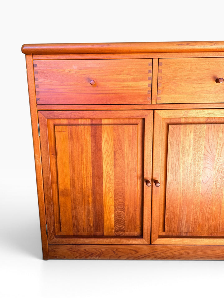 Teak sideboard drawers and paneled doors, left detail