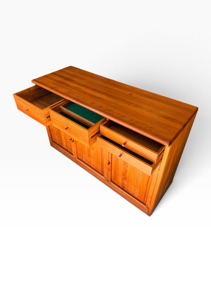Teak sideboard with drawers open, high angle
