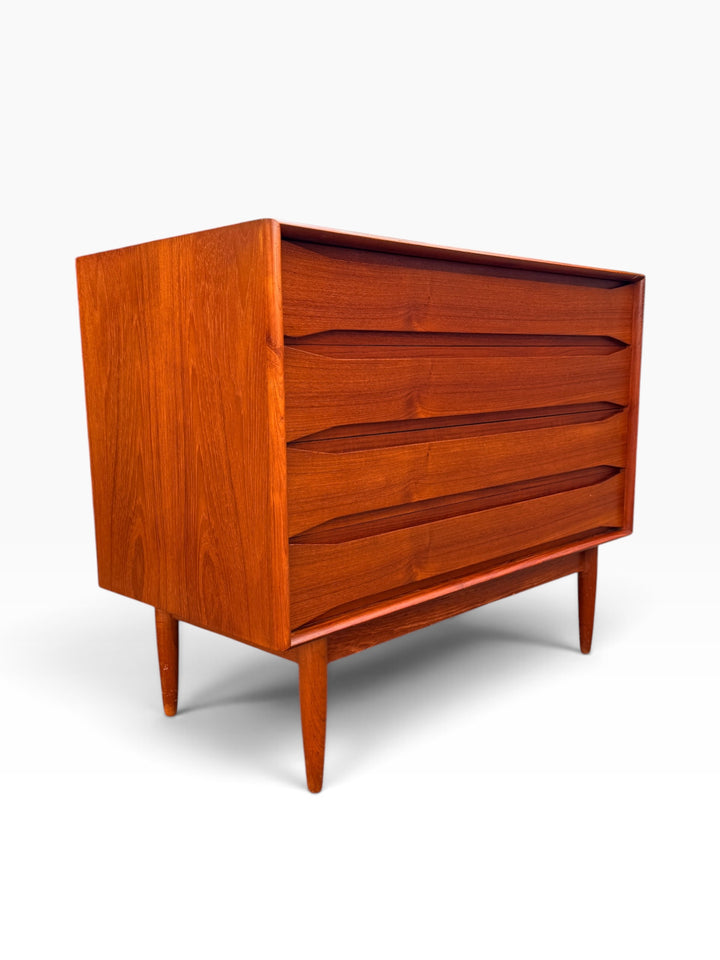 Teak dresser angled view showing sculpted full-width pulls