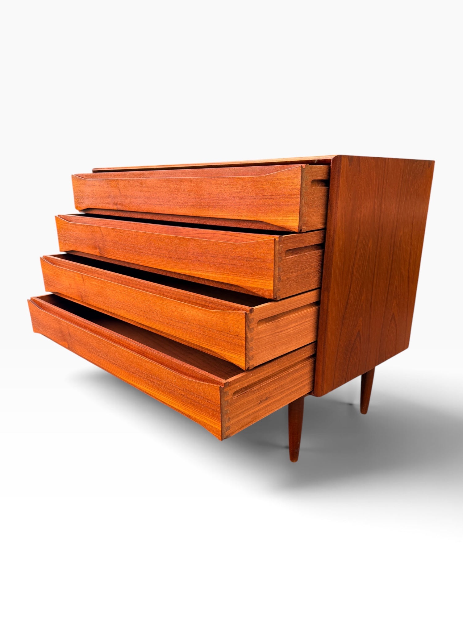 Teak dresser with drawers extended, side angle