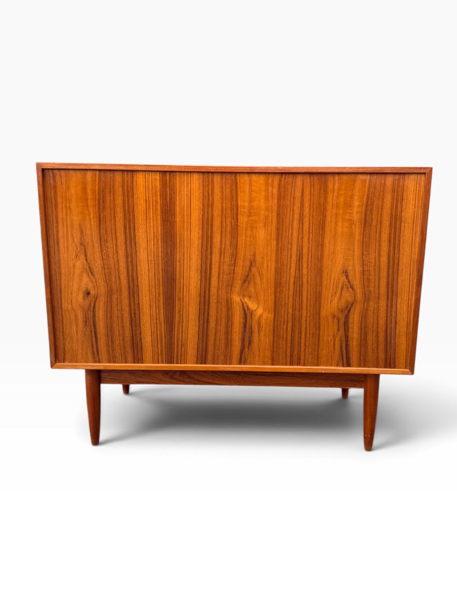 Finished book-matched teak back of the dresser
