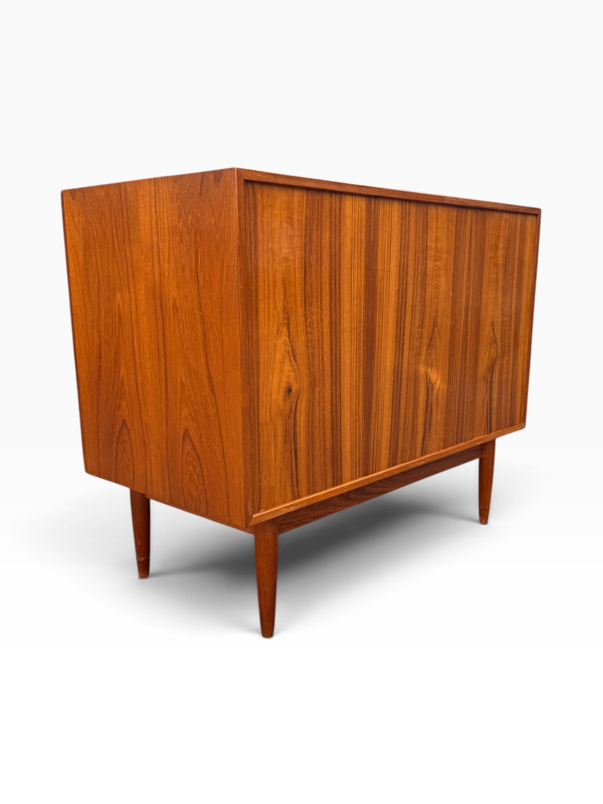 Rear three-quarter view of the teak dresser
