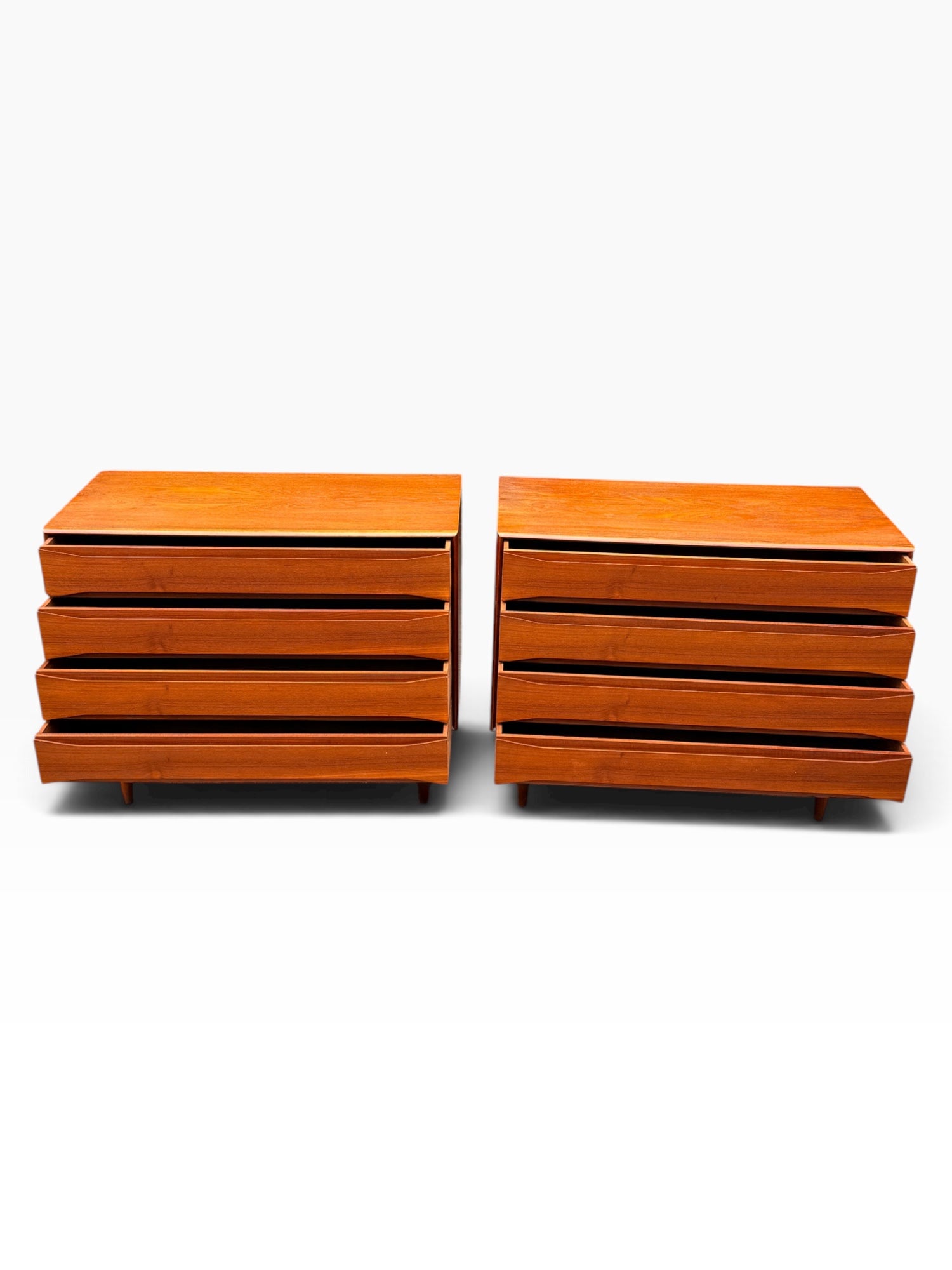 Pair of Danish teak dressers with drawers slightly open