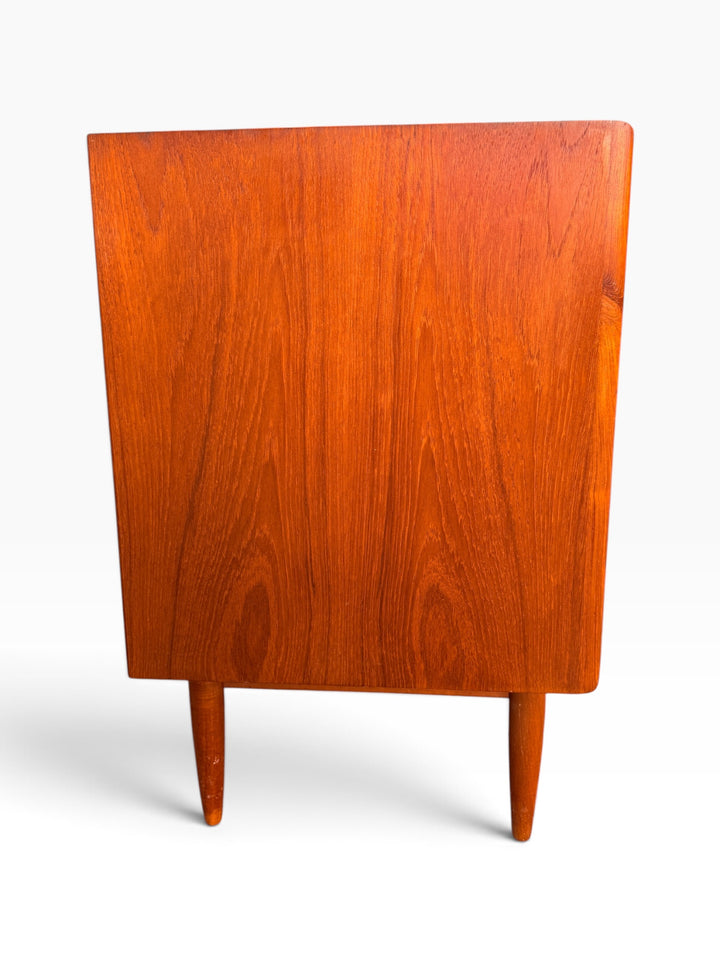 Detail of sculpted full-width teak drawer pull