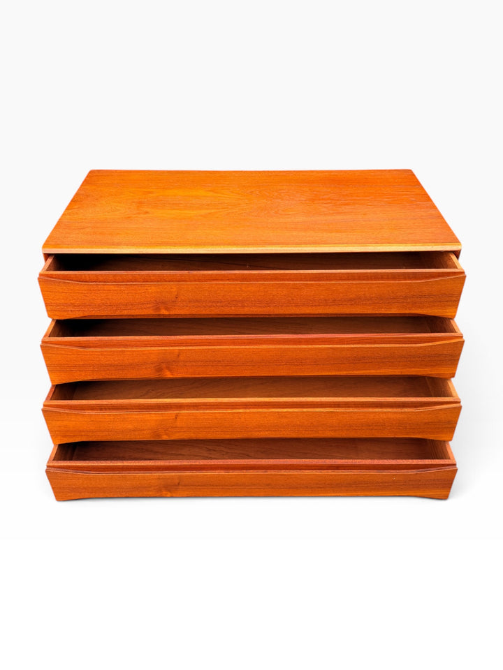 Teak dresser with drawers open from the front