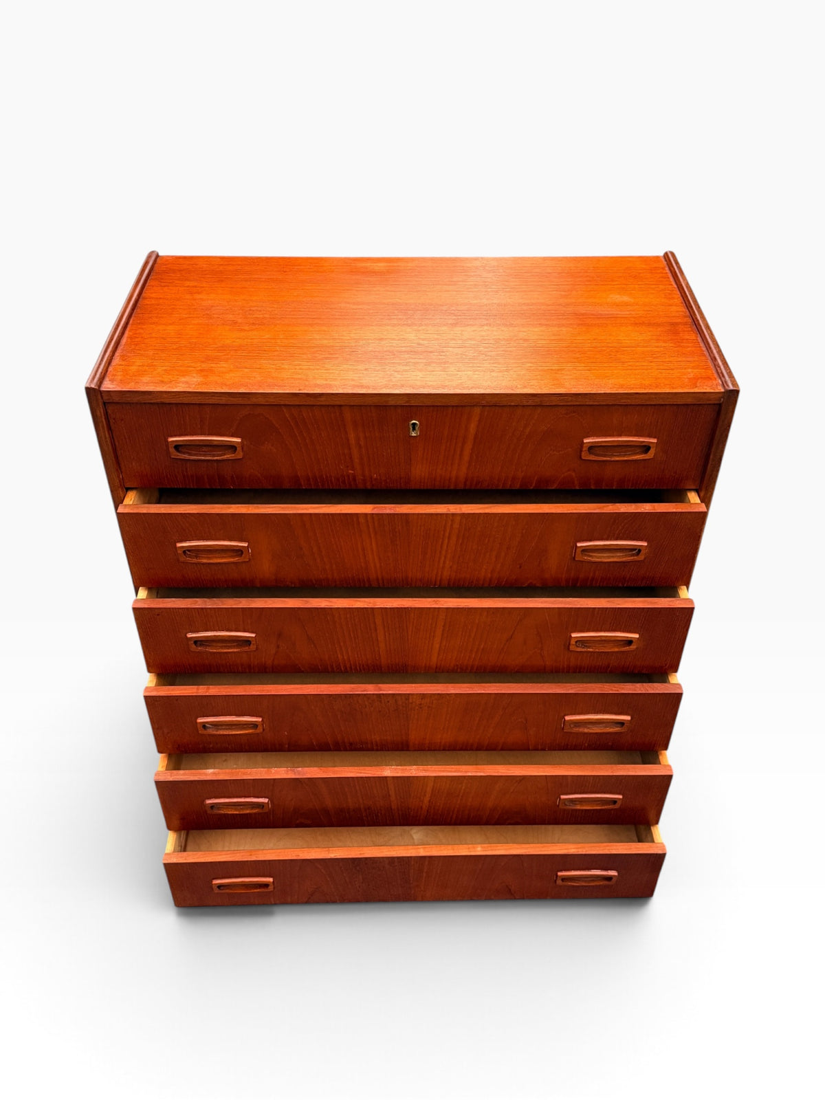 Teak dresser with all six drawers open