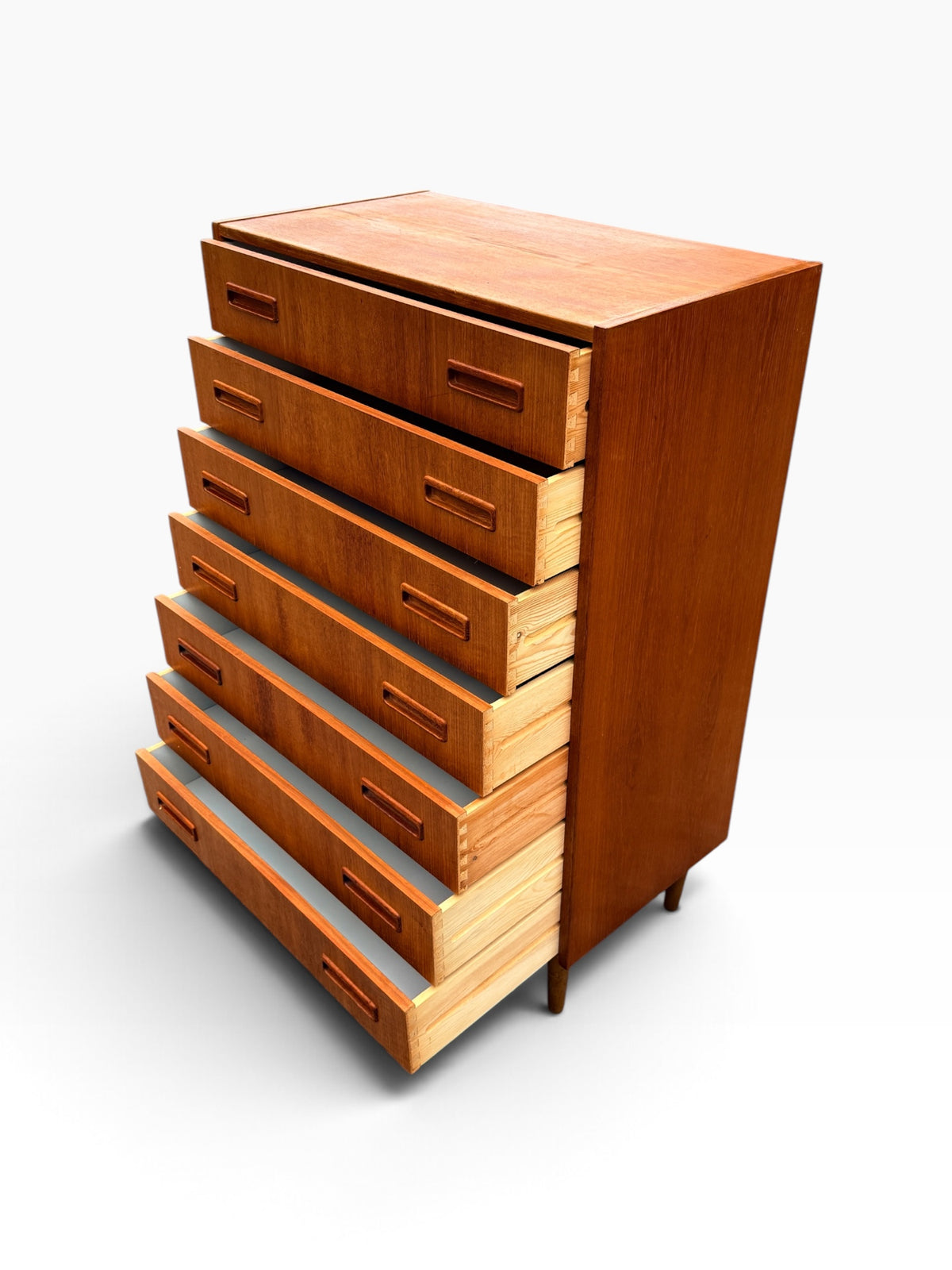 Teak tallboy with all drawers open