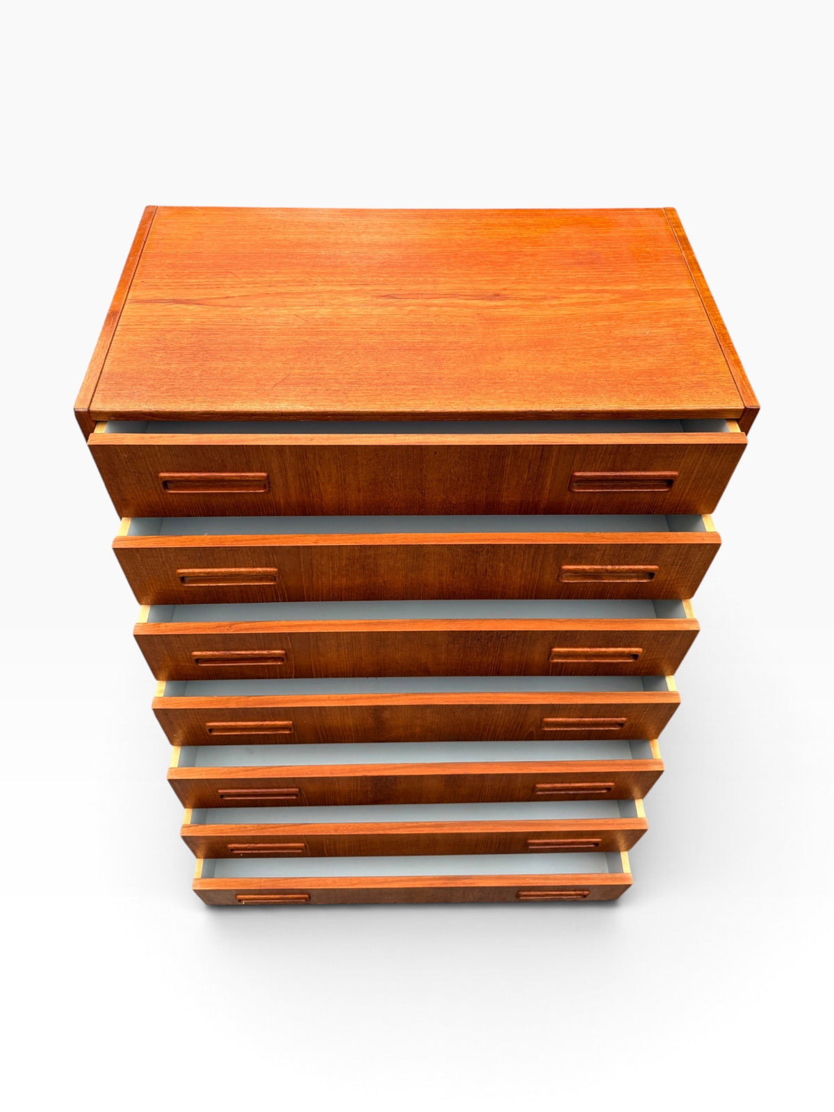 Teak dresser with drawers open, high angle