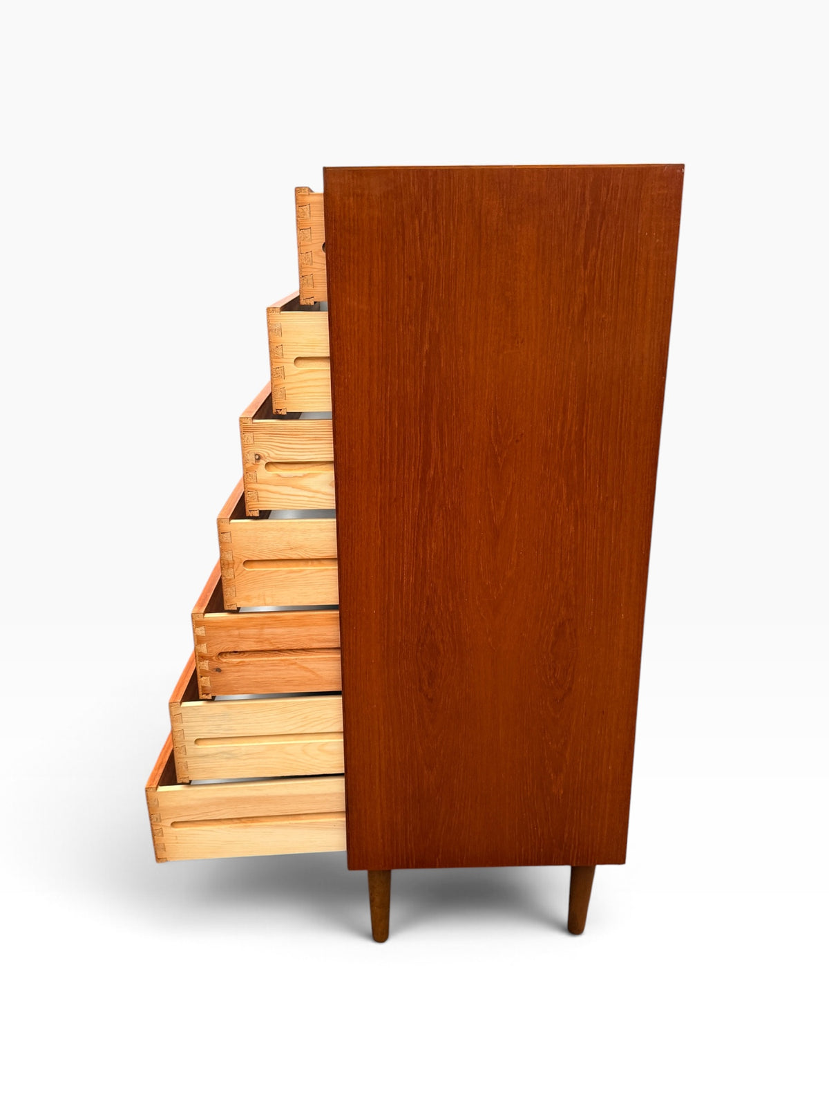 Teak dresser with drawers open, side view