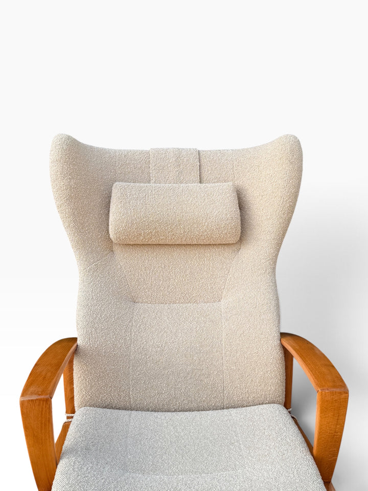 Close-up of high winged back and boucle headrest pillow