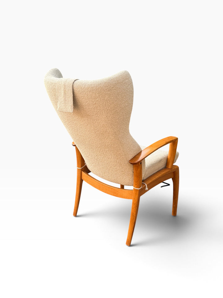 Rear three-quarter view of wingback recliner