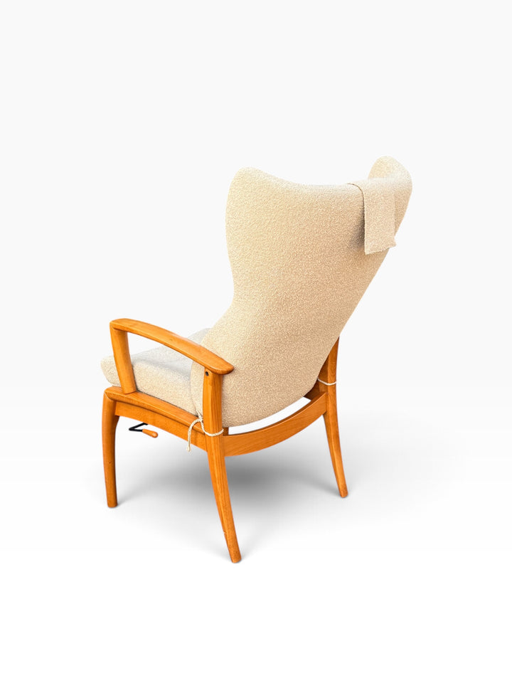 Rear angled view of cream boucle wingback