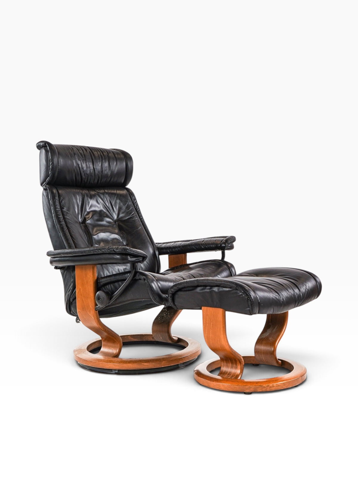 Vintage Ekornes Stressless black leather recliner with matching ottoman and teak ring base