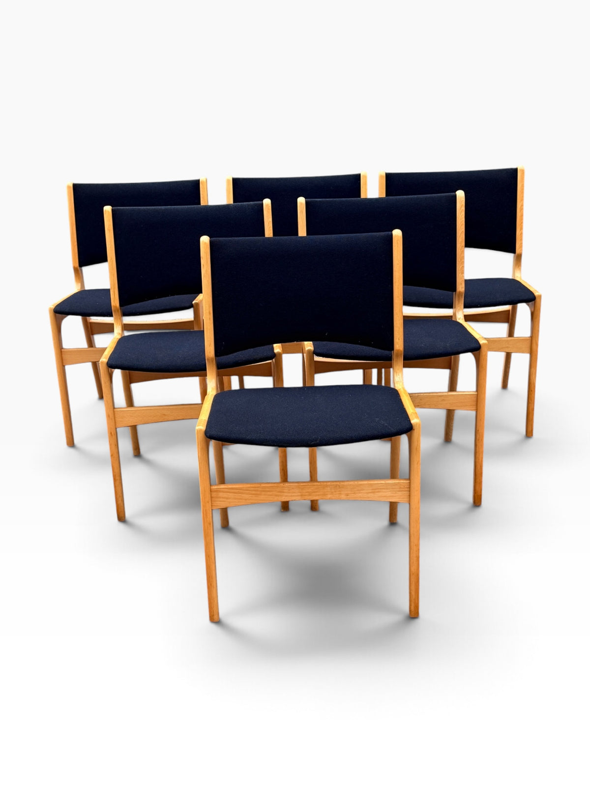 Six Danish beech dining chairs, grouped front view