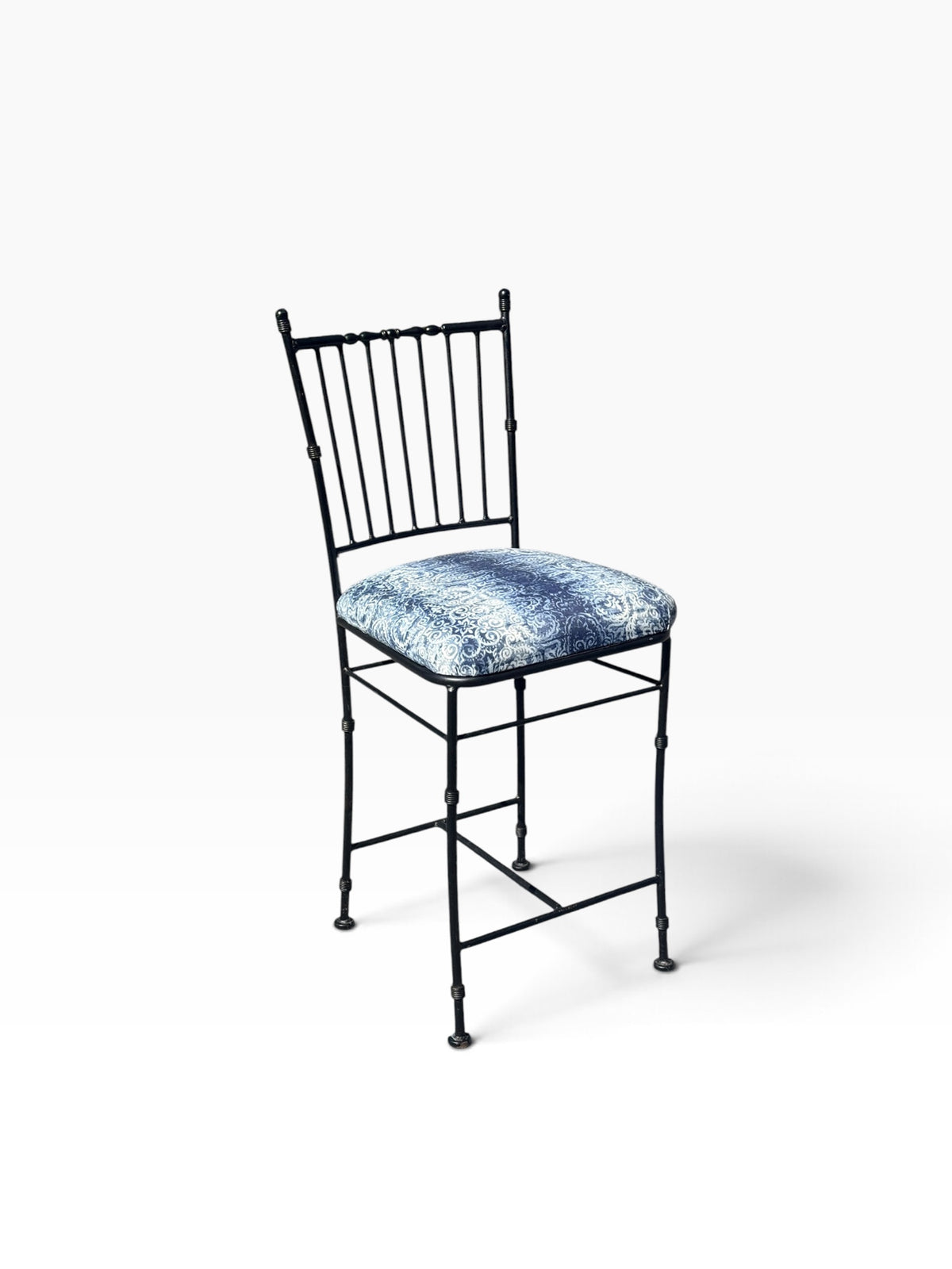 Opposite three-quarter view of the black iron counter stool