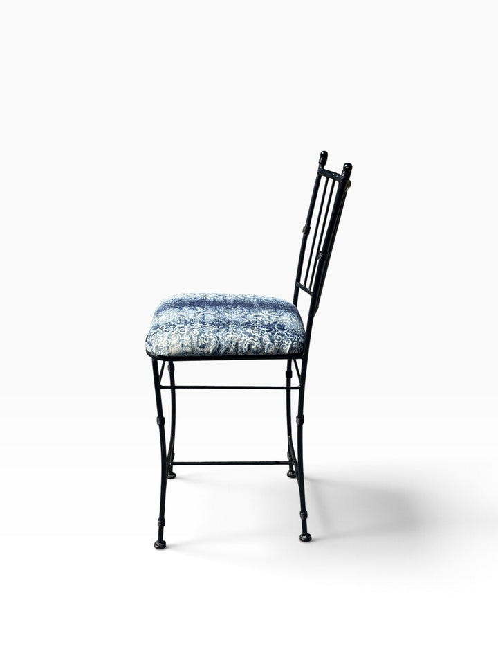 Side profile of the counter stool showing the angled back and footrest stretchers