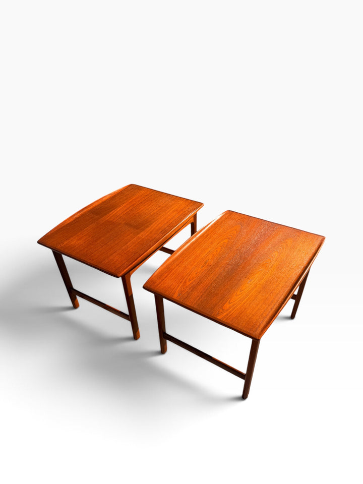 Pair of mid-century teak end tables with upturned edges