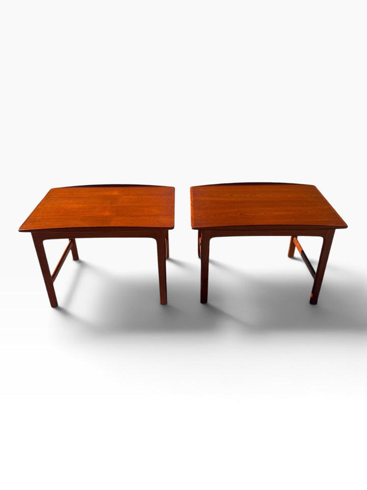 Pair of teak end tables showing upturned surfboard tops