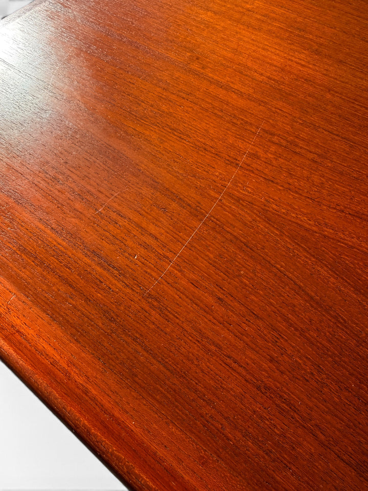 Teak surface detail showing minor surface scratches