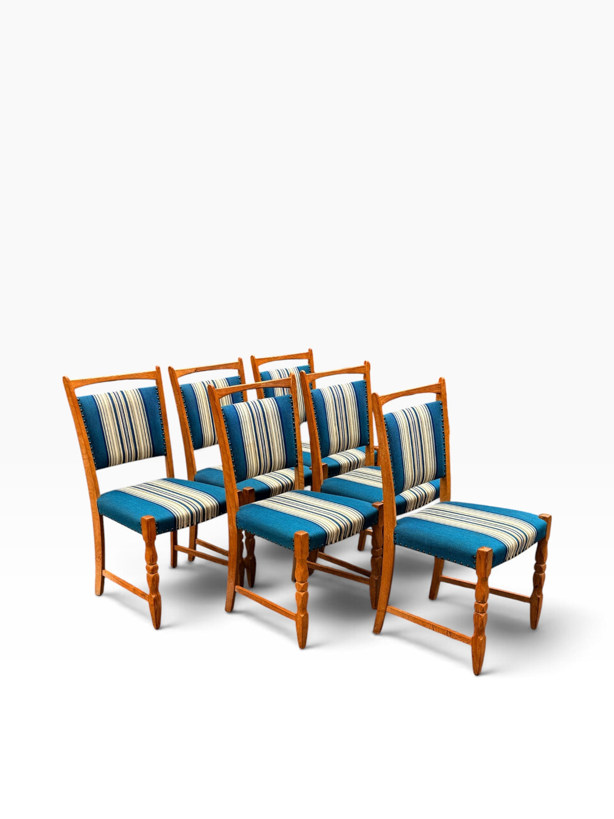 Six Danish oak dining chairs, side group view