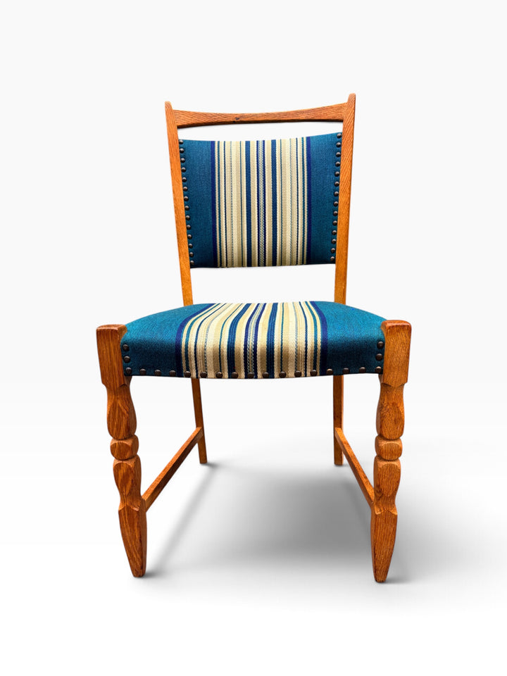 Oak dining chair showing turned and carved front legs