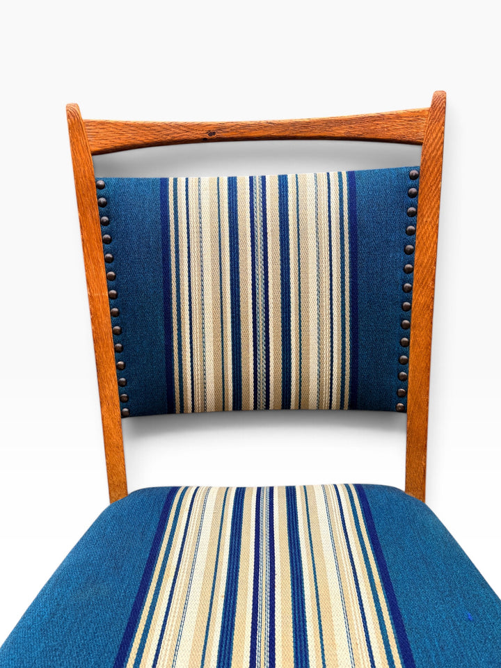 Striped upholstered back with brass nailhead trim